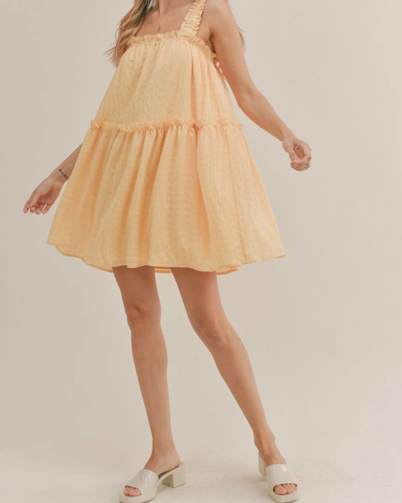 Back of a model wearing a size Large Spring Sunshine Mini Dress in Lemon in Lemon by Sadie & Sage. | dia_product_style_image_id:339964